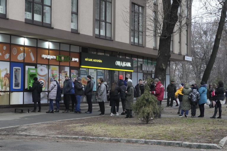 Ukrainians are fleeing cities en masse and forced to queue for money and food