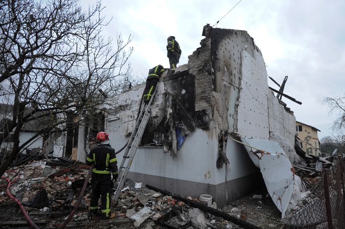 Firefighters work at the destroyed museum in Lviv.
