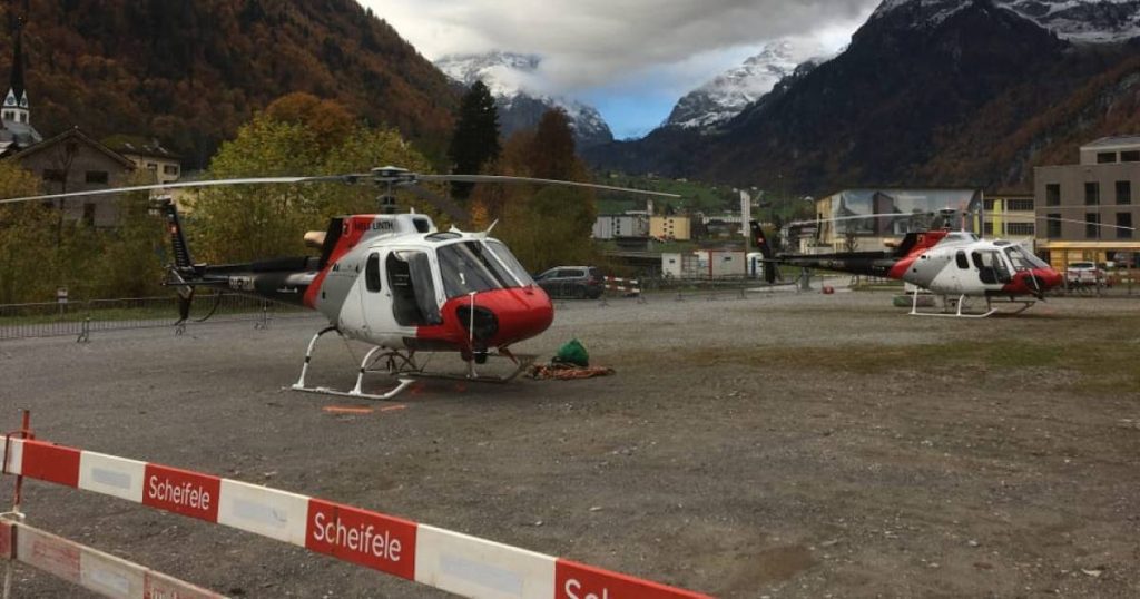 In the Swiss Alps, train passengers briefly take a helicopter ride |  outside