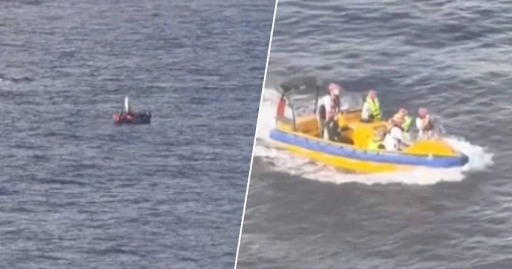 look.  The crew of the largest cruise ship in the world rescues fourteen people in a small boat at sea  outside